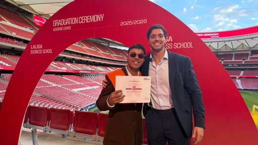 Jai Agarwal holding his LaLiga Business School diploma beside Alejandro Sierra Capitán, under the 2025/2026 graduation ceremony arch